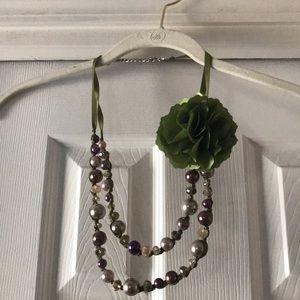 Statement necklace with green flower detail